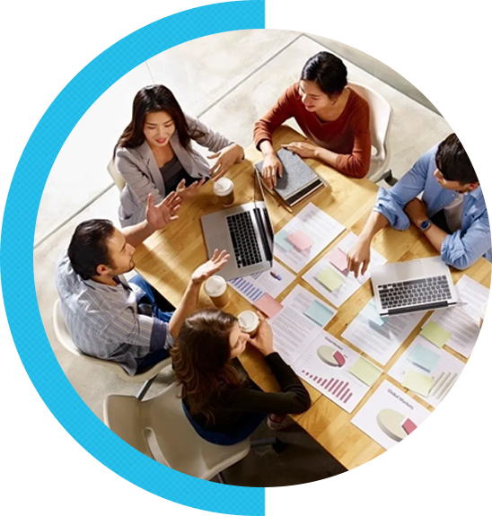 A group of people sitting around a table.